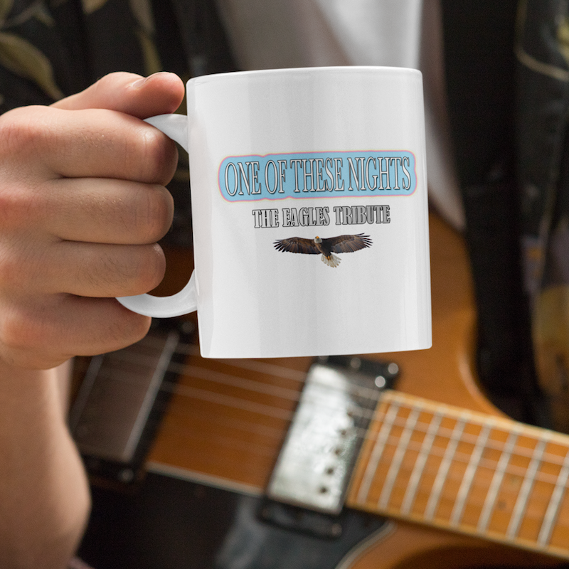 mockup of a musician holding an 11 oz coffee mug 33324.png